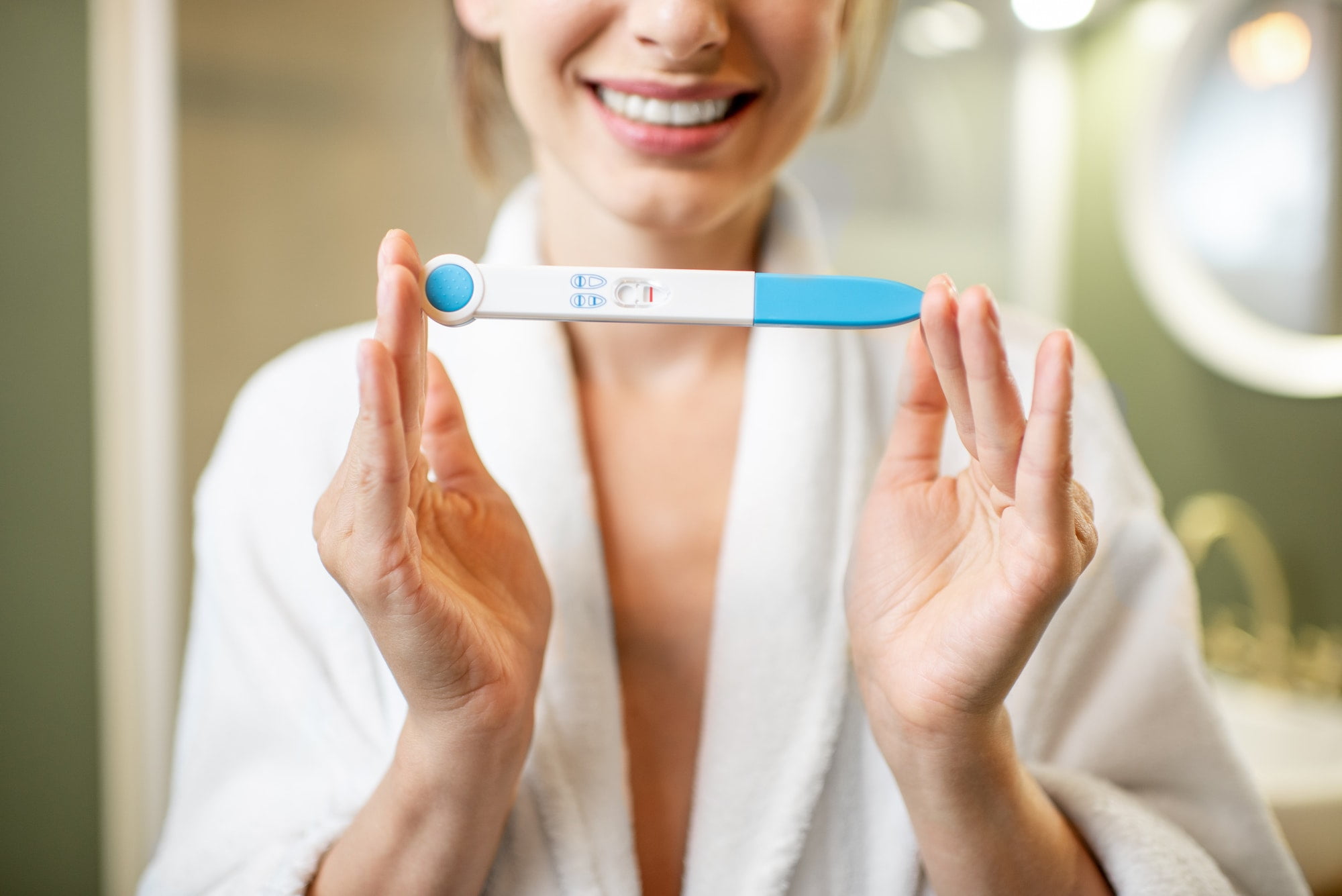 Holding pregnancy test stick All about Dye Stealer Pregnancy Test: Must-Know for Parents