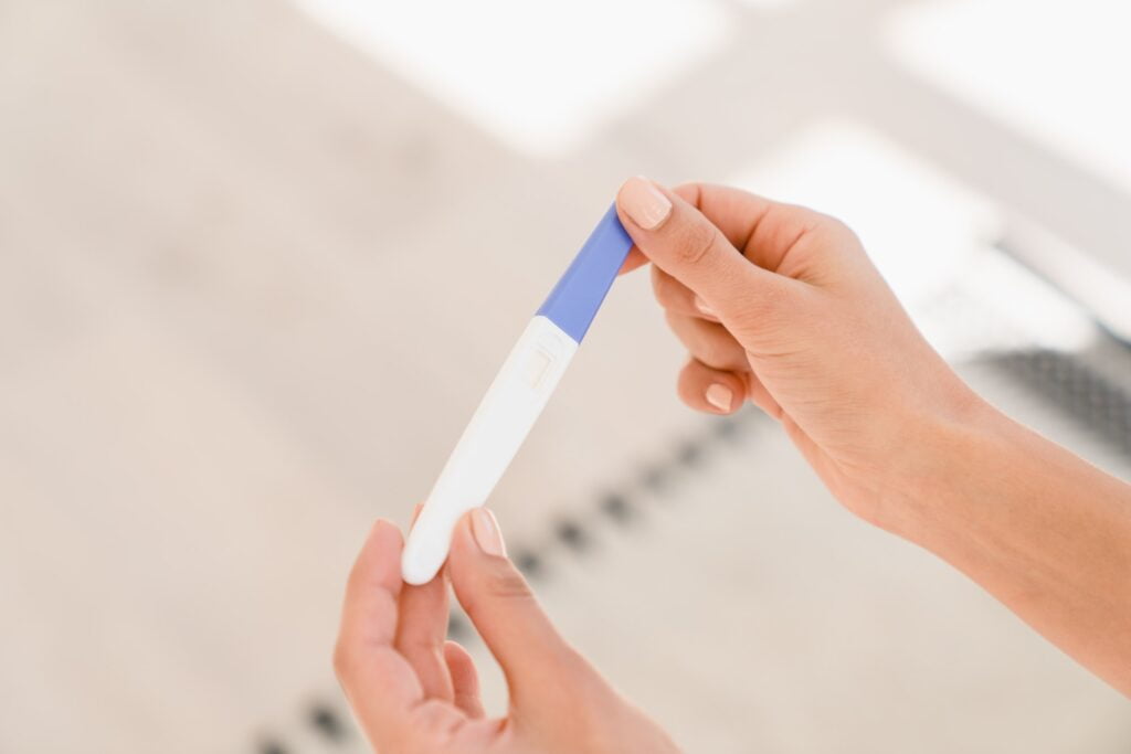 Pregnancy test. Woman female teenager holding pregnancy test, childbirth planning, ovulation. All about Dye Stealer Pregnancy Test: Must-Know for Parents